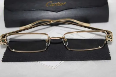 Armazón oftálmico Cartier dorado rectangular con cabezas de pantera en las bisagras