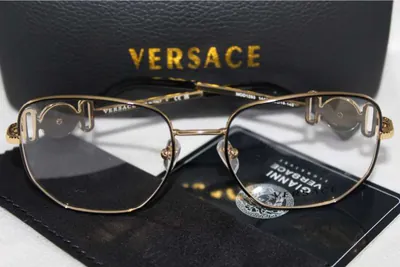 Armazón oftálmico Versace dorado con la Medusa en las patillas