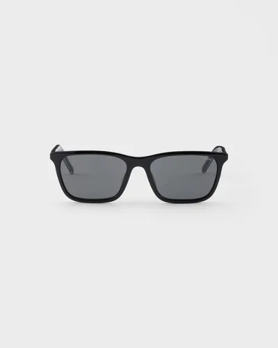 Lentes de sol Prada negros rectangulares